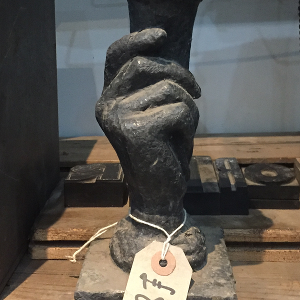 Priced hand sculpture at reclamation centre