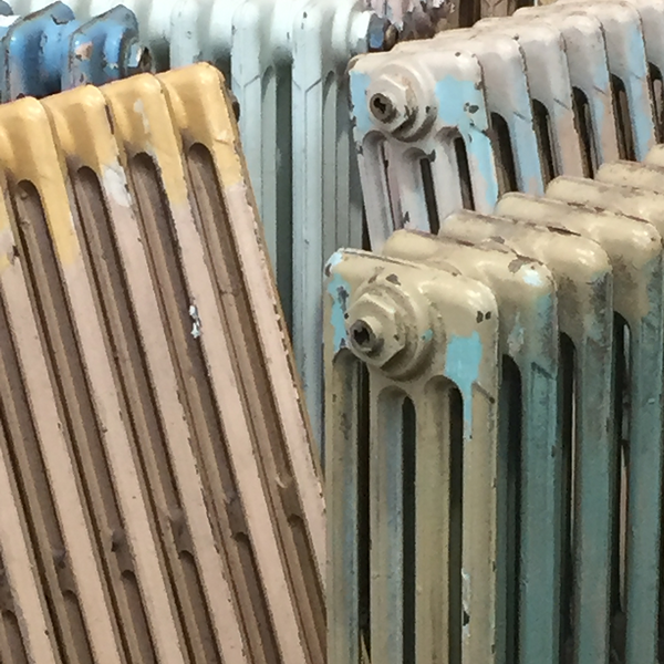 Old painted radiators at a reclamation centre
