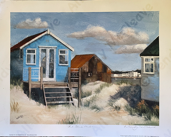 Print of a blue beach hut on Mudeford Sandbank Spit with a view of Christchurch behind