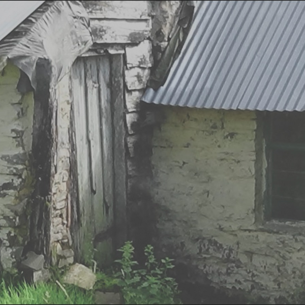 an old building with.a tin roof