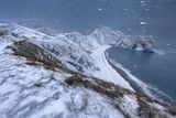 13 Durdle Door in a Snowstorm by Tony Gill