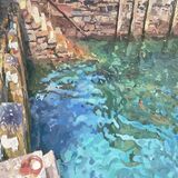Reflective patterns on the high tide at Fowey quay
