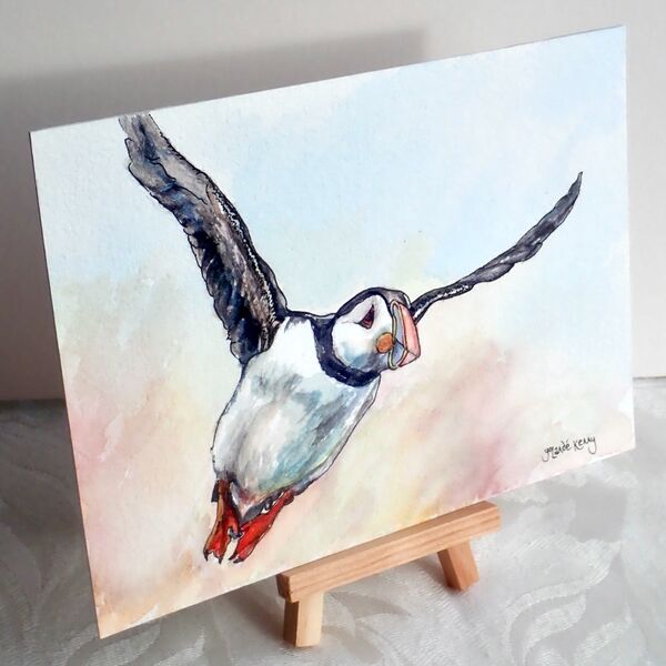 Flying puffin with easel