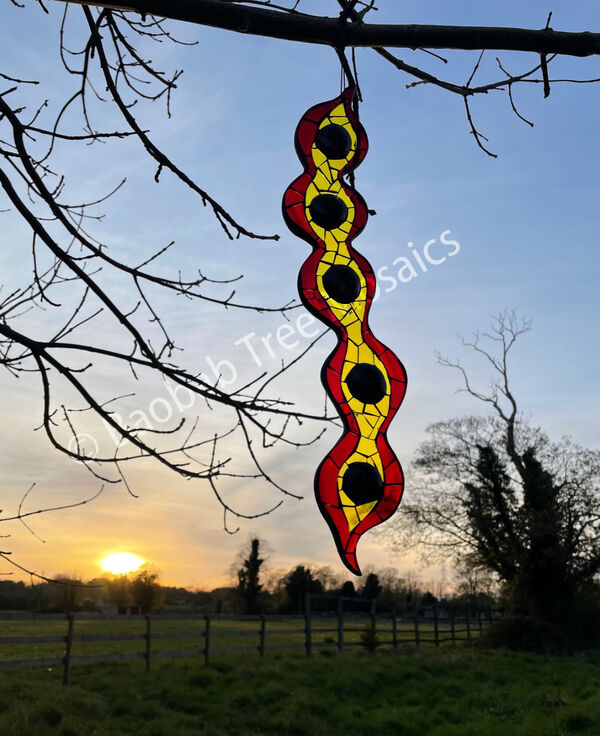 large seed pod mosaic hanging